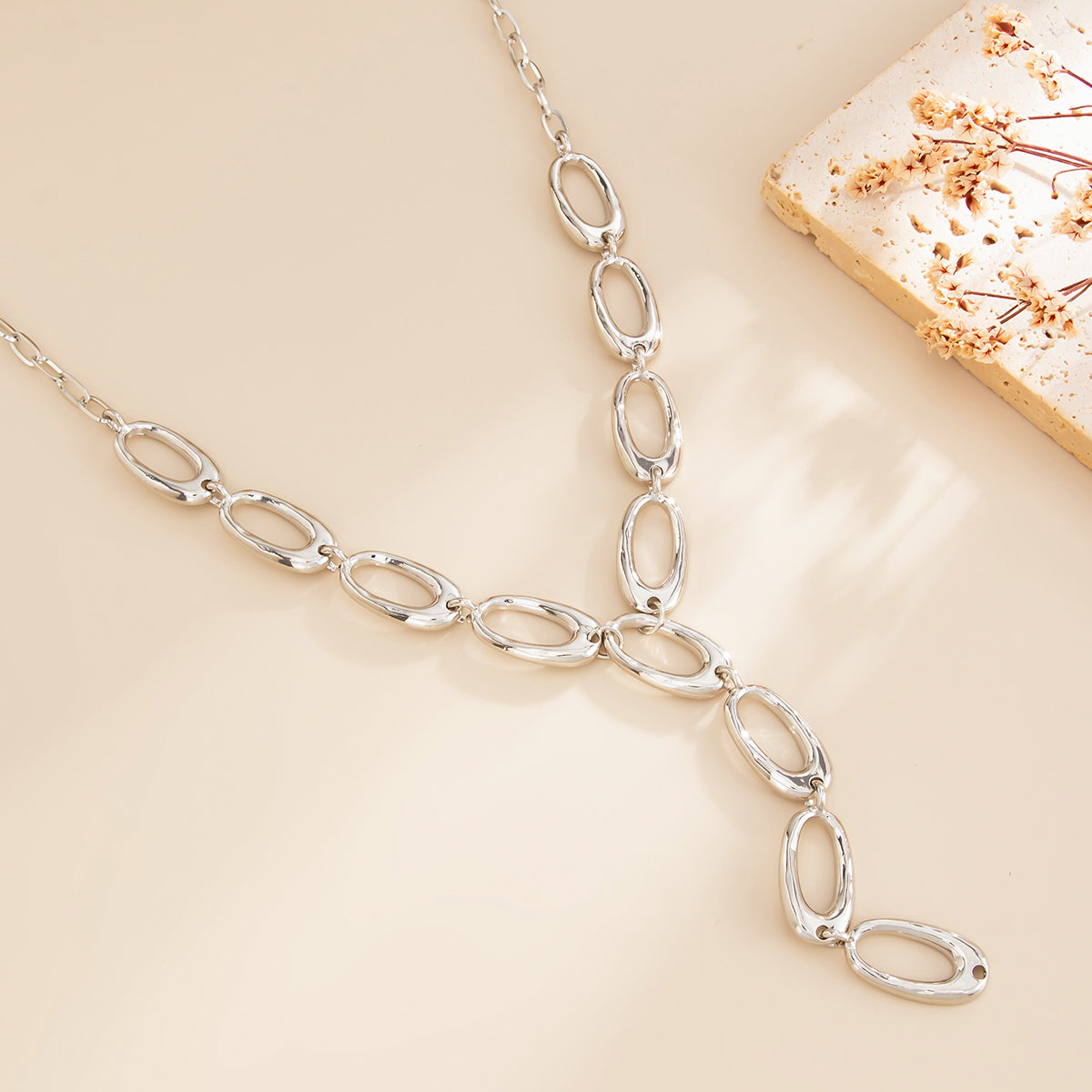 Silvertone Open Oval Drop Necklace, dainty minimalist design, side view