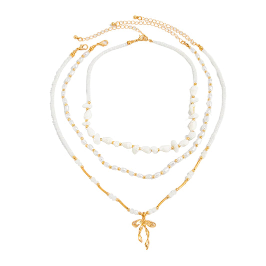 Pearl and Shell Acrylic Goldtone Bow Pendant Necklace Set, gold pendant necklace for women, botanical inspired, front view