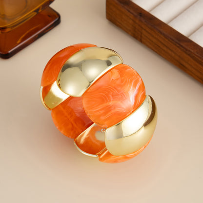 Orange Resin and Goldtone Petals Stretch Bracelet, everyday style, side view