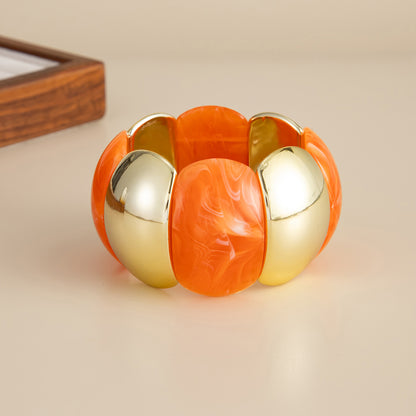Orange Resin and Goldtone Petals Stretch Bracelet, everyday style, detail close-up