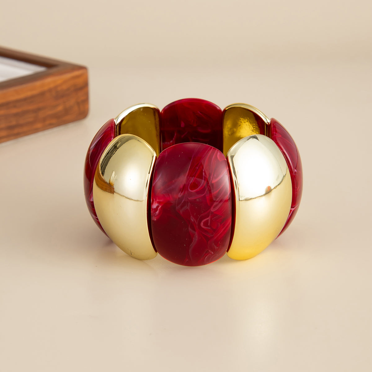 Dark Red Resin and Goldtone Petals Stretch Bracelet, dainty minimalist design, detail close-up