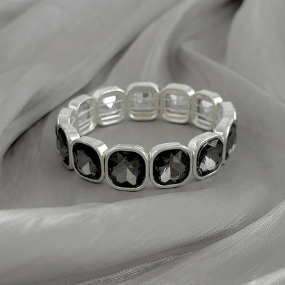 Crystal and Silvertone Square Station Tennis Bracelet, botanical inspired, side view