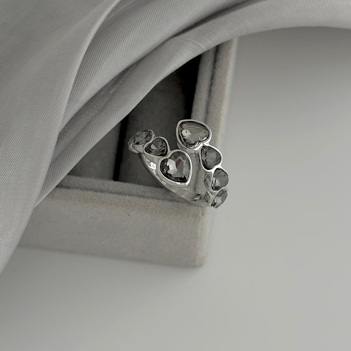 Gray Crystal and Silvertone Linked Heart Bypass Ring, dainty minimalist design, detail close-up