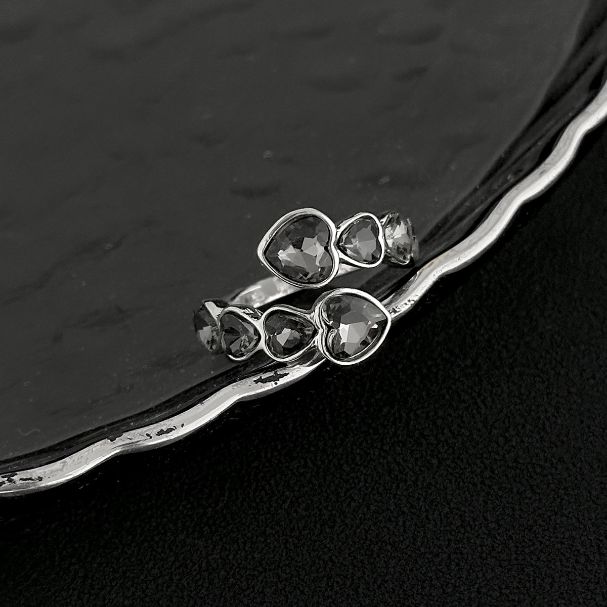 Gray Crystal and Silvertone Linked Heart Bypass Ring, dainty minimalist design, side view