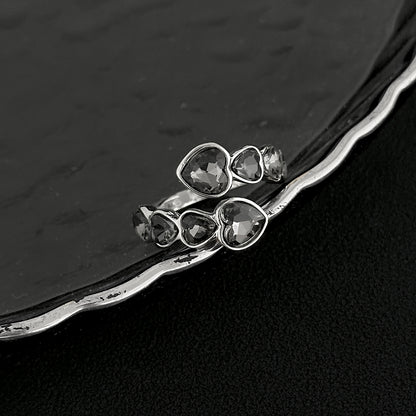 Gray Crystal and Silvertone Linked Heart Bypass Ring, dainty minimalist design, side view