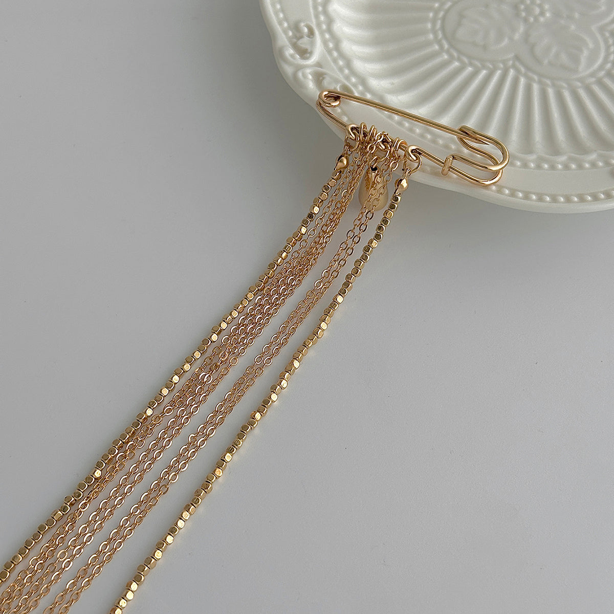 Goldtone Drop Tassel Pin Brooch, everyday style, detail close-up