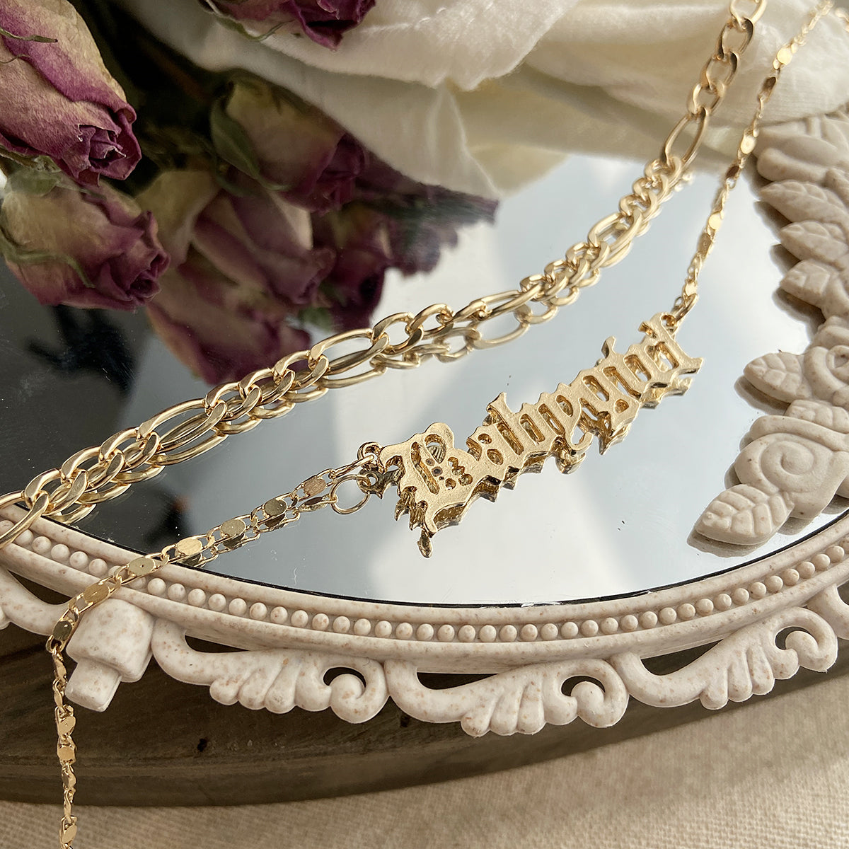 Stylish 18K gold-plated layered bar necklace, featuring the name 'Baby Girl' crafted in radiant gold for a personal touch.