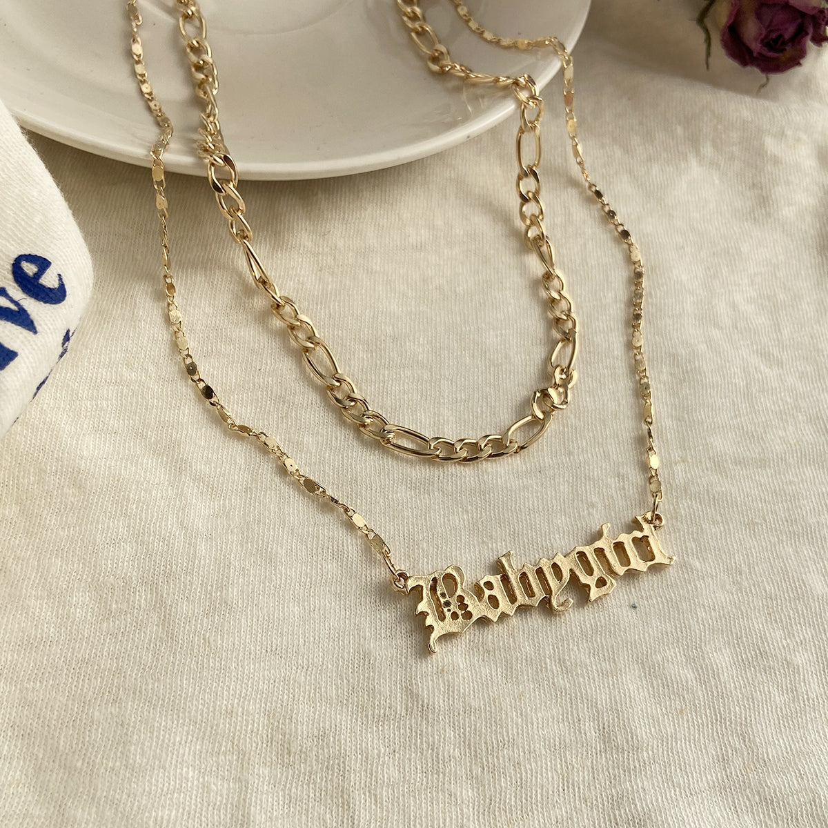 Chic 18K gold-plated necklace with a layered bar, elegantly displaying the name 'Baby Girl' in shimmering gold.