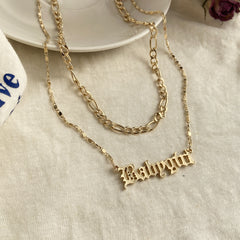 Chic 18K gold-plated necklace with a layered bar, elegantly displaying the name 'Baby Girl' in shimmering gold.