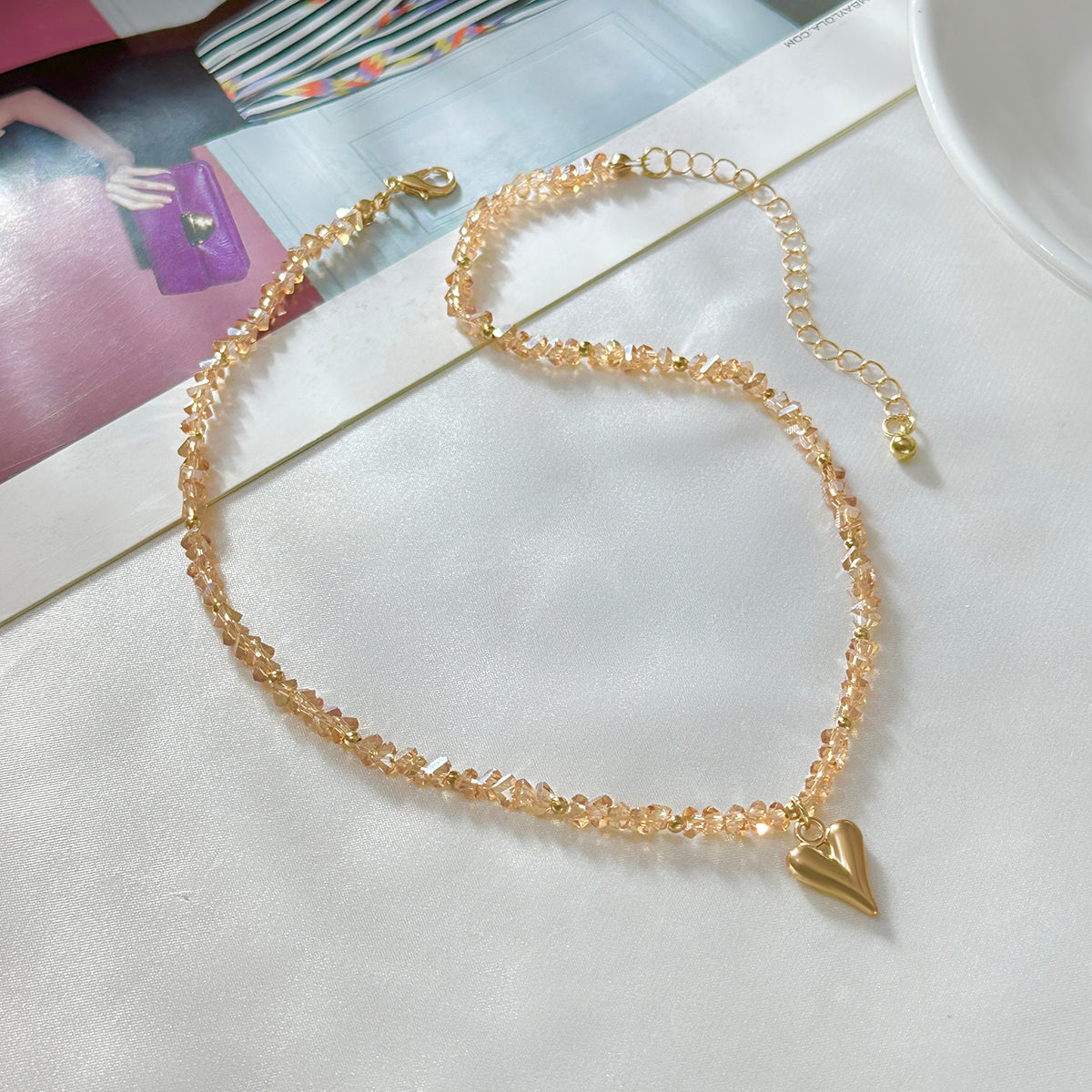 Champagne Acrylic and Goldtone Heart Pendant Necklace, botanical inspired, side view