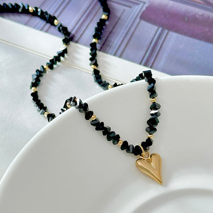 Black Acrylic and Goldtone Heart Pendant Necklace, everyday style, detail close-up