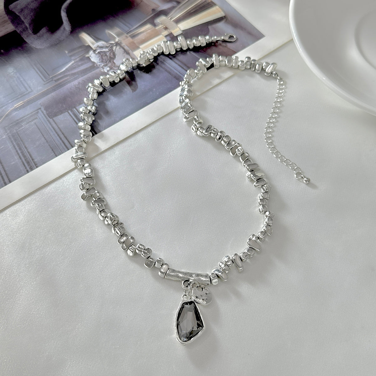 Crystal and Silvertone Irregular Bead Pendant Necklace, botanical inspired, side view