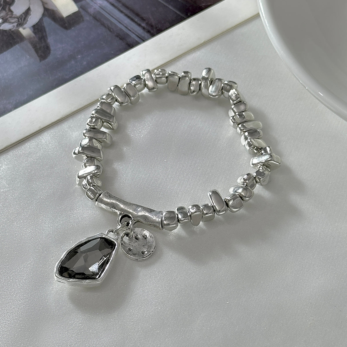 Gray Crystal and Silvertone Irregular Beads Charm Bracelet, silver bracelet for women, botanical inspired, side view