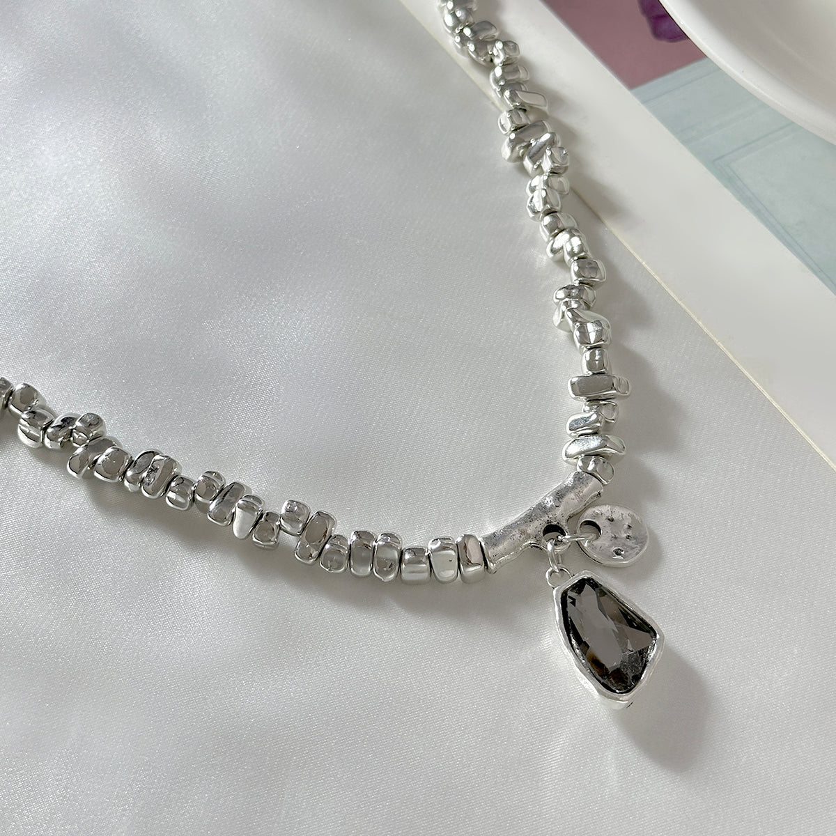 Crystal and Silvertone Irregular Bead Pendant Necklace, botanical inspired, detail close-up