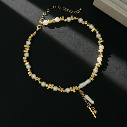 Baroque Pearl and Goldtone Bead Chain Heart Tassel Necklace, vintage-inspired design, side view