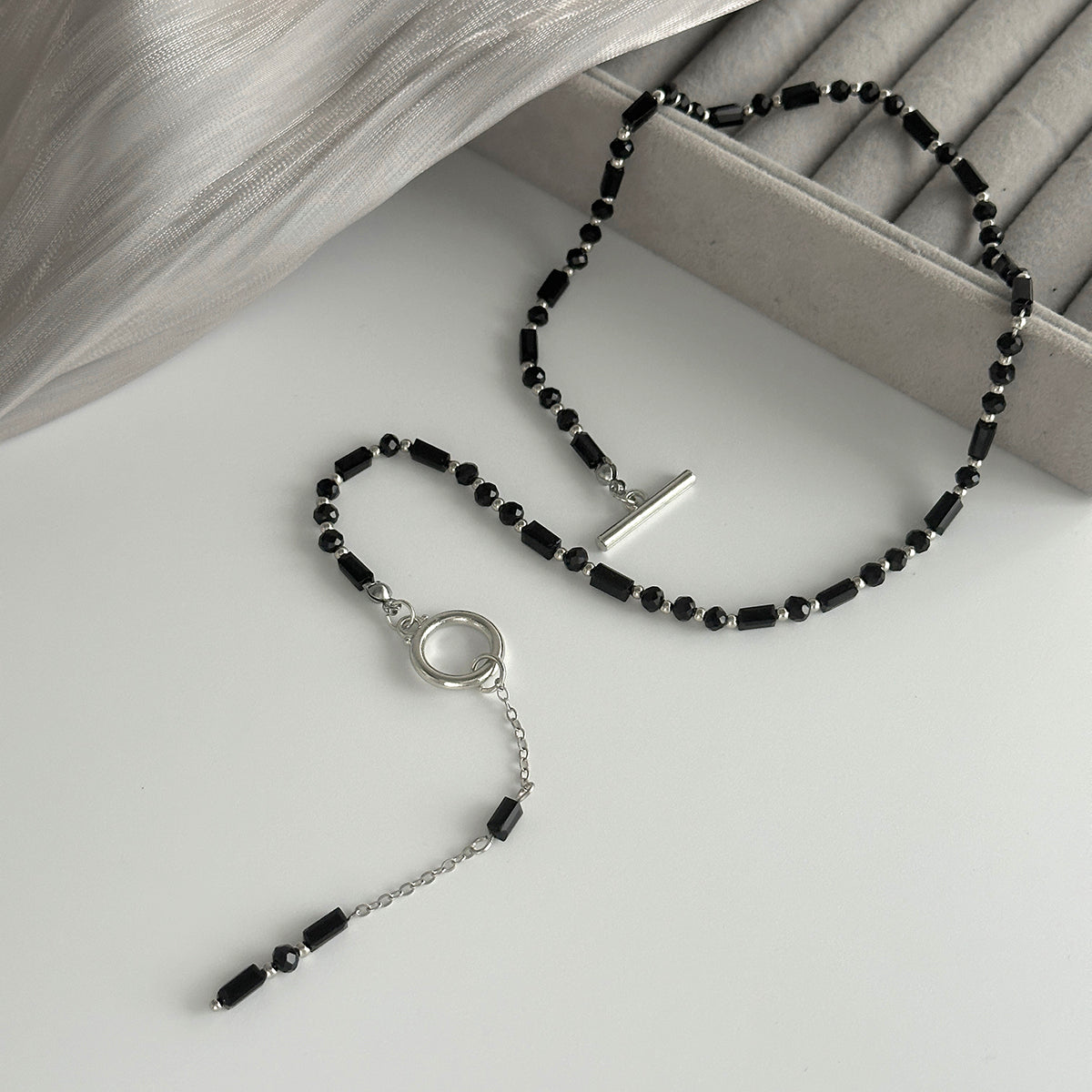 Black Acrylic and Silvertone Drop Toggle Necklace, dainty minimalist design, detail close-up