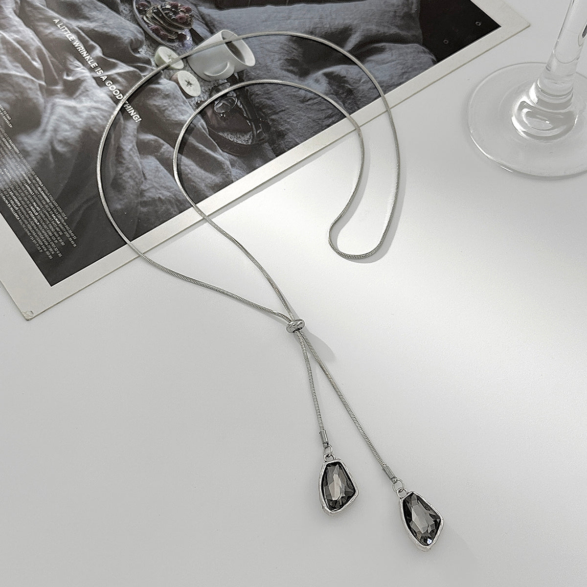 Crystal and Silvertone ‌Trapezium‌ Dual-Drop Long Necklace, botanical inspired, side view