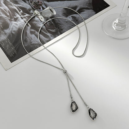 Crystal and Silvertone ‌Trapezium‌ Dual-Drop Long Necklace, botanical inspired, side view