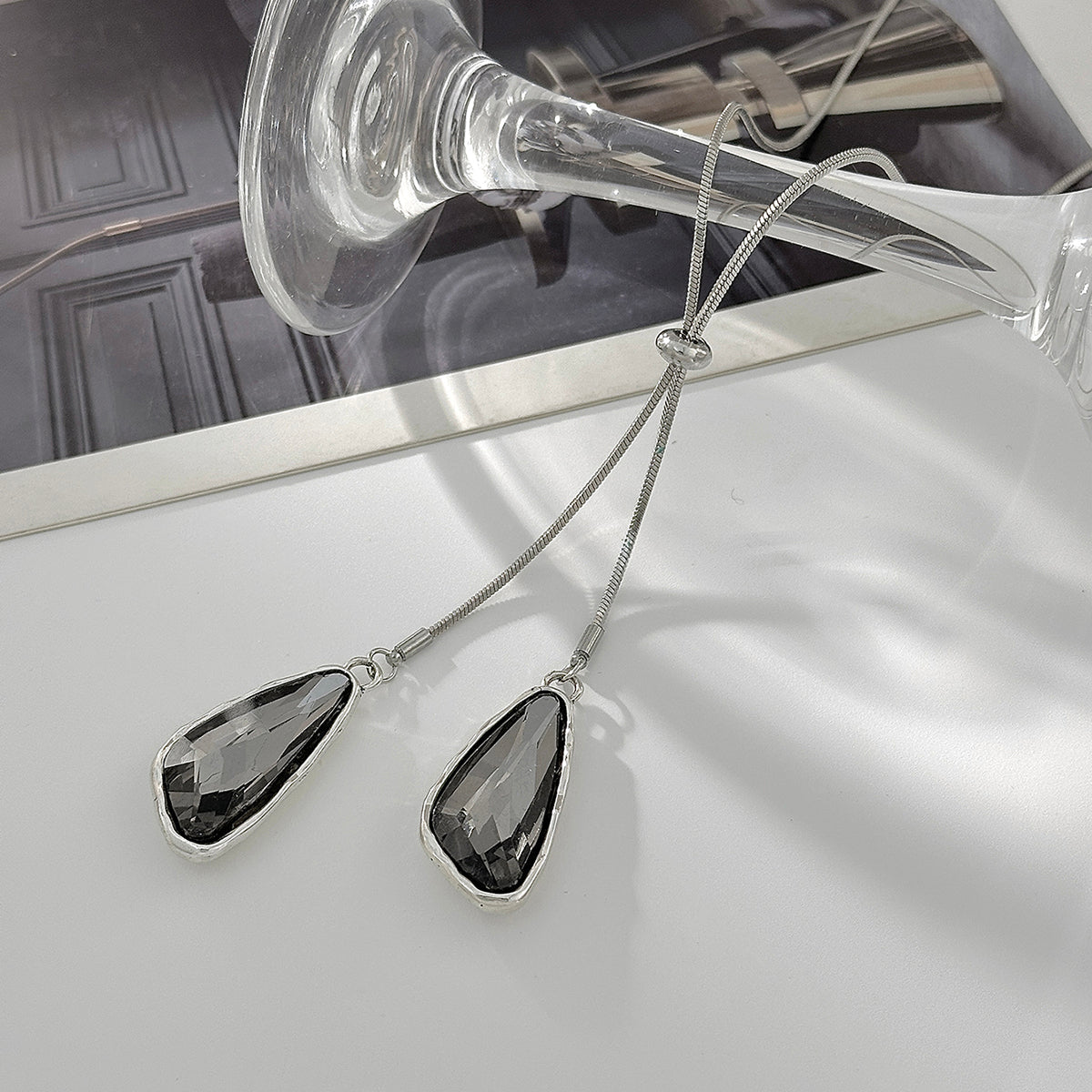 Crystal and Silvertone ‌Triangle Dual-Drop Long Necklace, vintage-inspired design, detail close-up