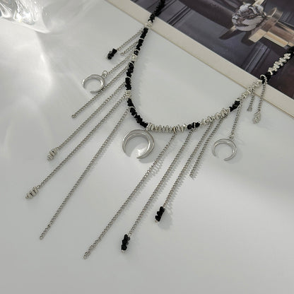 Black Acrylic and Silvertone Moon Pendant Tassel Necklace, vintage-inspired design, detail close-up