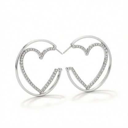 Cubic Zirconia and Silver-Plated Heart Huggie Earrings, silver huggie earrings, dainty minimalist design, side view