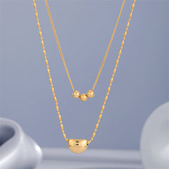 Stunning 18K gold-plated layered necklaces with chic beads on each chain, adding a touch of elegance to your outfit.