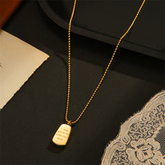 Beautiful 18K gold-plated dog tag necklace showcasing the touching phrase, "Love You To The Moon & Back."