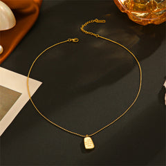 A charming gold dog tag necklace with the loving message, "Love You To The Moon & Back," ideal for a special gift.