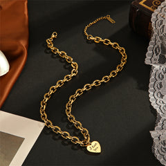 Dazzling gold chain necklace with a heart charm, a perfect accessory to symbolize love and elegance.
