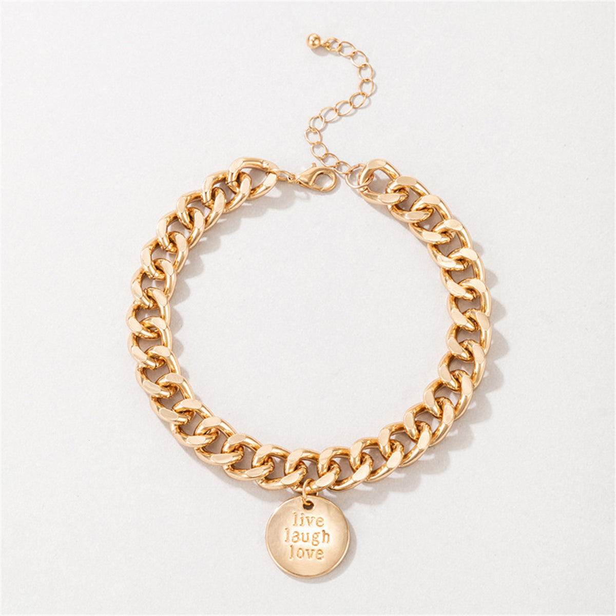 Beautiful 18K gold-plated anklet showcasing a chunky curb chain and a unique coin charm, a must-have accessory for fashion lovers.