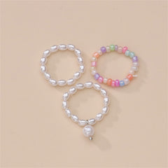 A set of three vibrant rings adorned with pearls and a charming pearl accent, designed as a stretch ring set.