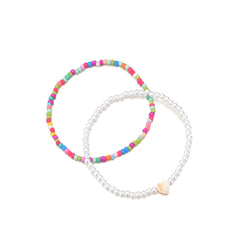 Two stretch anklets with colorful beads and a heart charm, featuring a striking red multicolor howlite design.
