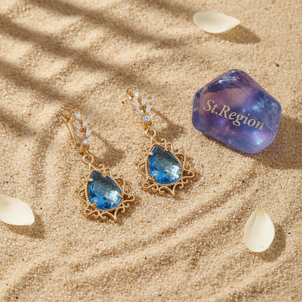 Blue Crystal and 18K Gold-Plated Scroll Drop Huggie Earrings, gold huggie earrings, botanical inspired, detail close-up