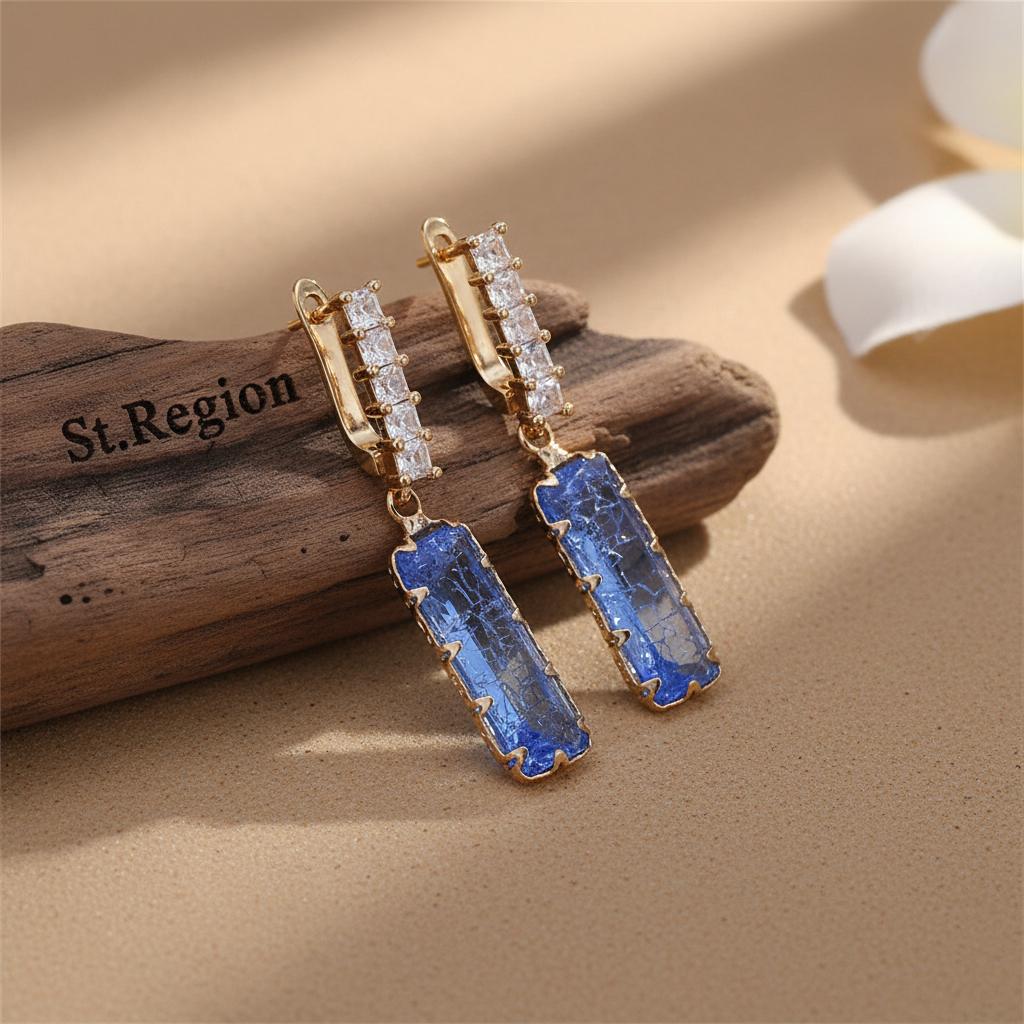 Light Blue Crystal and 18K Gold-Plated Baguette Huggie Earrings, gold huggie earrings, everyday style, front view