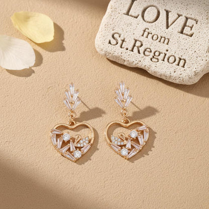 Cubic Zirconia and Goldtone Swan Heart Dangle Earrings, gold drop earrings for women, vintage-inspired design, lifestyle look