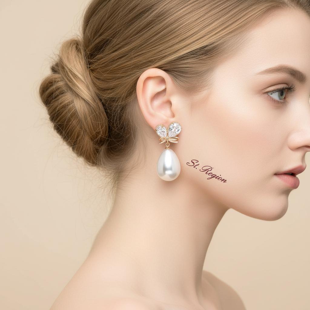 Pear Crystal and Pearl Goldtone Butterfly Drop Earrings, gold drop earrings for women, dainty minimalist design, styled look