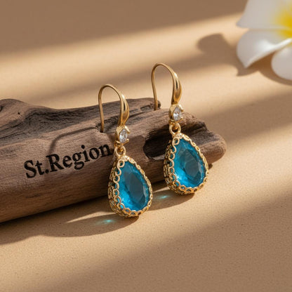 Blue Crystal and Cubic Zirconia Goldtone Teardrop Hook Earrings, gold drop earrings for women, everyday style, front view
