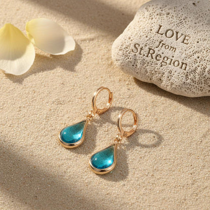 Blue Glass and Goldtone Drop Shape Huggie Earrings, gold drop earrings for women, vintage-inspired design, lifestyle look