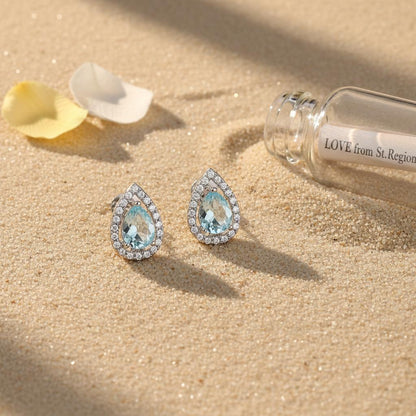 Blue Topaz and Cubic Zirconia Silvertone Hola Drop Huggie Earrings, silver huggie earrings, lifestyle look