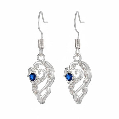Royal Blue Crystal and Silvertone Swirling Filigree Heart Hook Earrings, silver drop earrings for women, side view