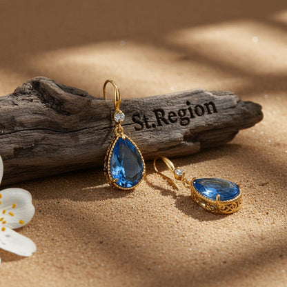 Blue Crystal and Cubic Zirconia Goldtone Teardrop Hook Earrings, gold drop earrings for women, botanical inspired, front view