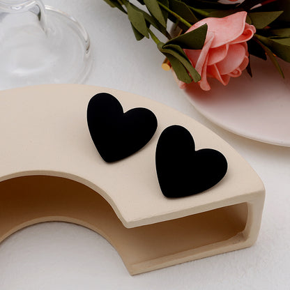 Black Acrylic and Silver-Plated Heart Stud Earrings, silver stud earrings for women, vintage-inspired design, detail close-up