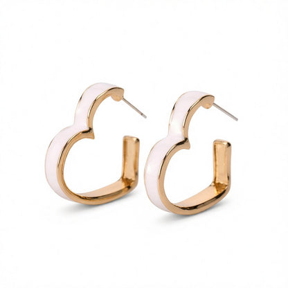 White Enamel and 18K Gold-Plated Heart Huggie Earrings, gold huggie earrings, everyday style, side view