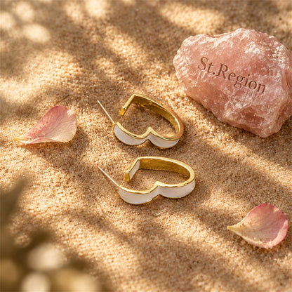 White Enamel and 18K Gold-Plated Heart Huggie Earrings, gold huggie earrings, everyday style, detail close-up
