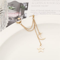 Chic gold ear cuff showcasing a star and moon, perfect for elevating your celestial-inspired look.