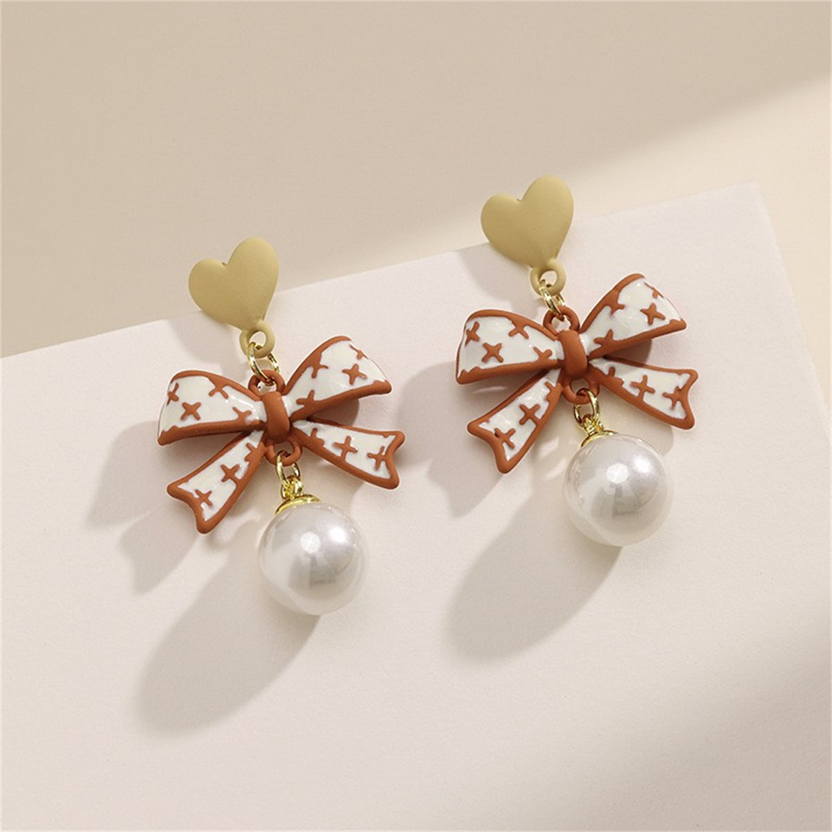 Pearl and Enamel 18K Gold-Plated Heart Bow Drop Earrings, gold drop earrings for women, vintage-inspired design, side view