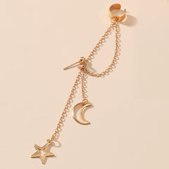 Dazzling gold ear cuff with a star and moon charm, a stylish addition to your celestial jewelry collection.