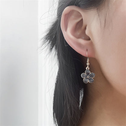 Black Enamel and 18K Gold-Plated Flower Drop Earrings, gold drop earrings for women, vintage-inspired design, detail close-up