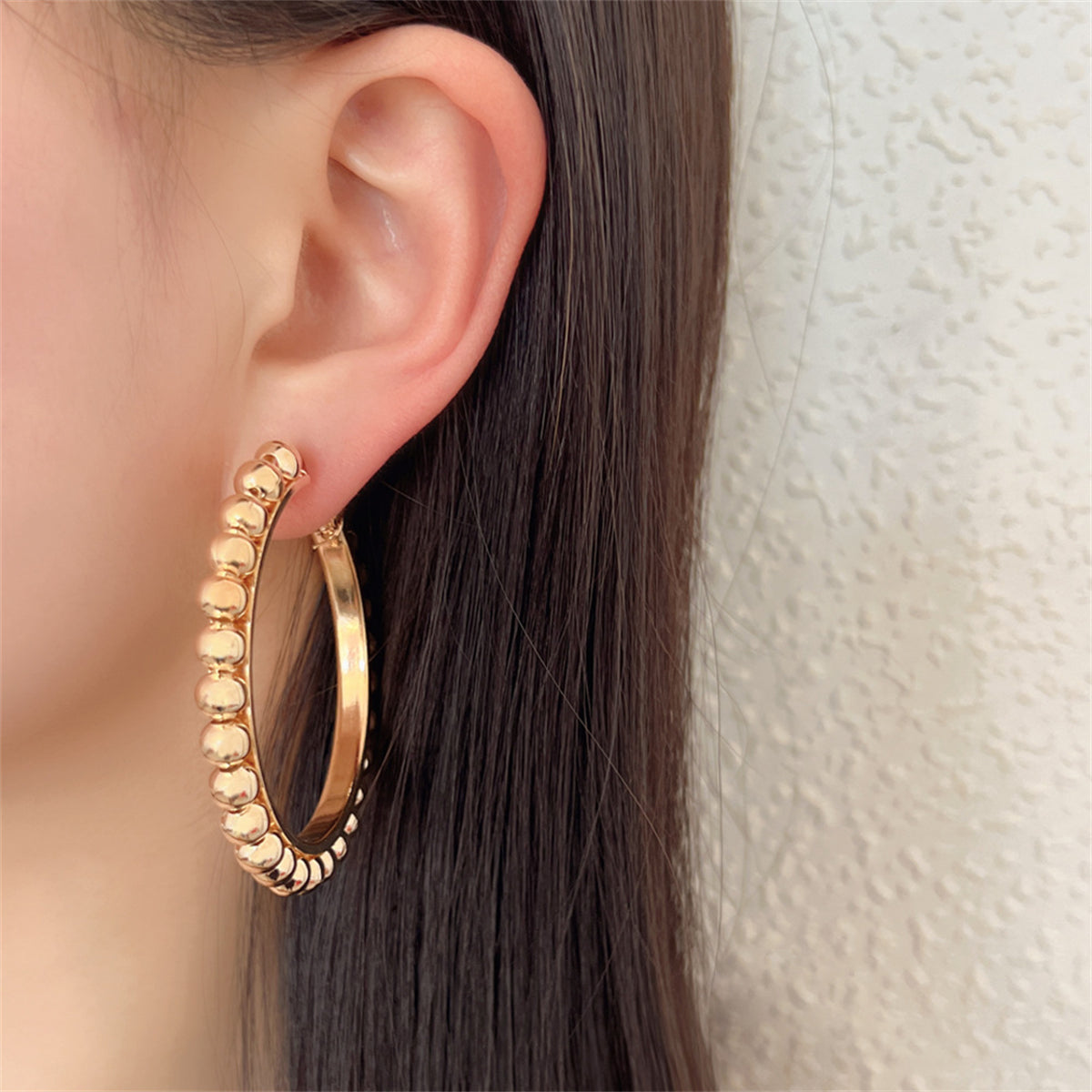 Stunning 18K gold-plated bead hoop earrings, crafted from metal, offering a chic and stylish accessory for any occasion.