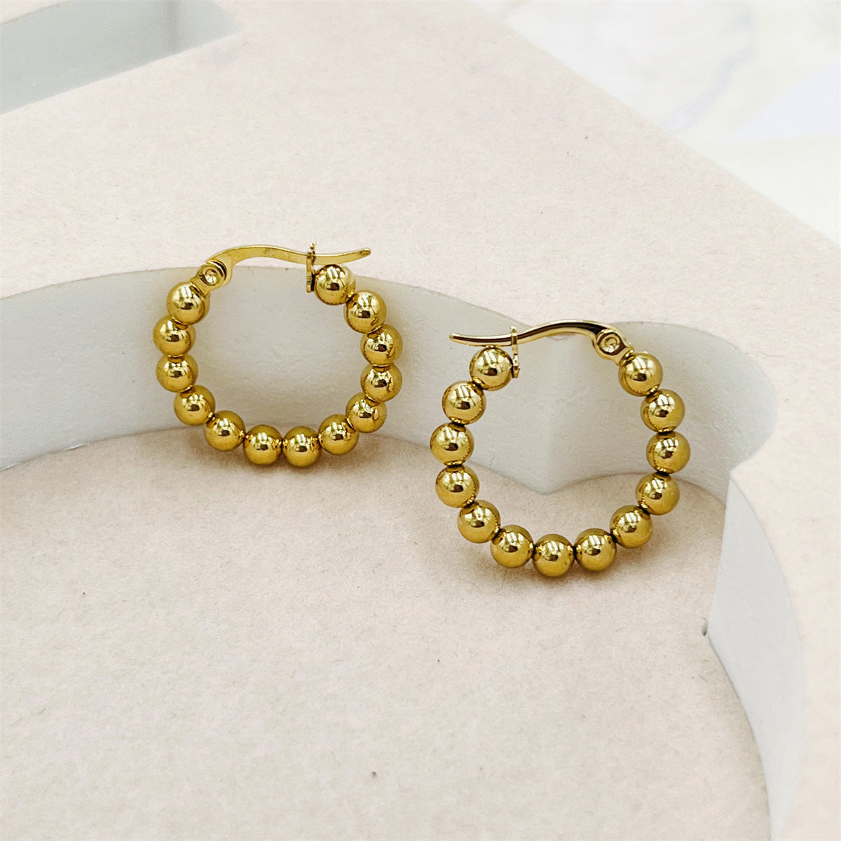 Elegant 18K gold-plated bead hoop earrings, featuring a stunning gold ball design for a chic and timeless look.
